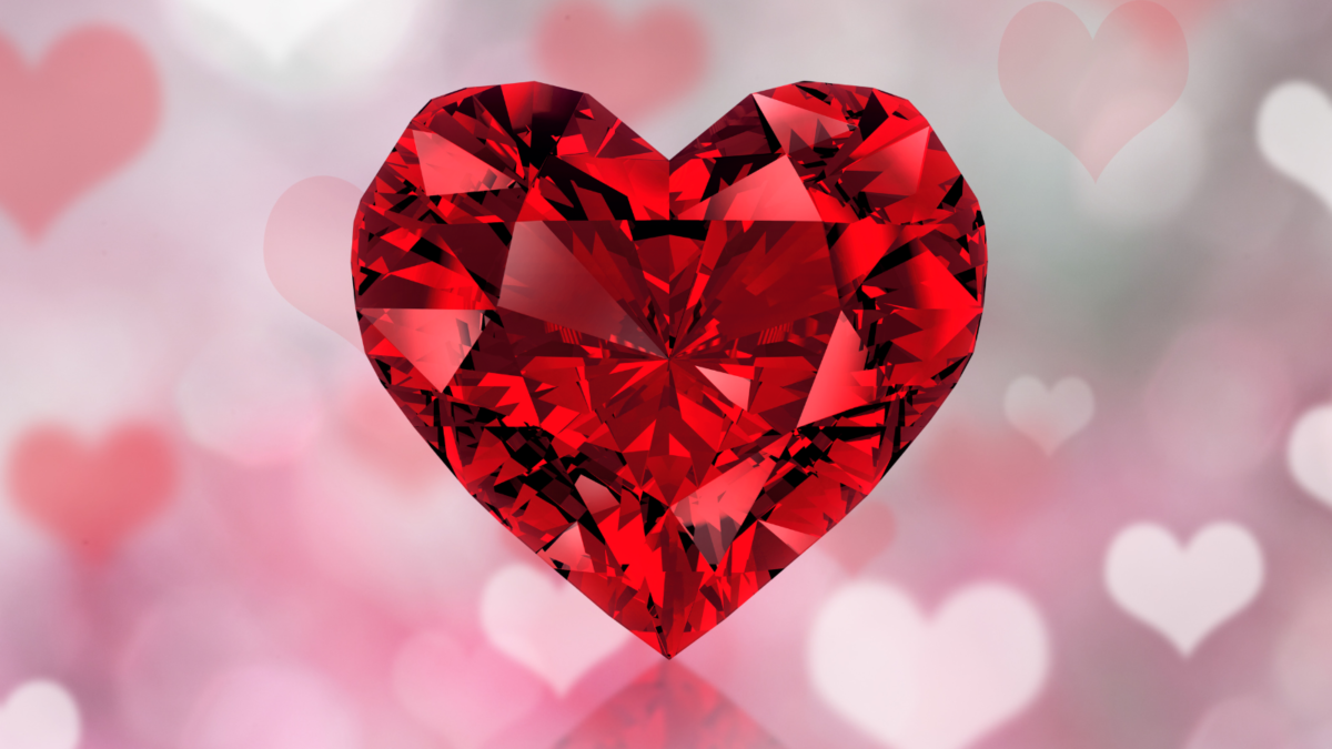 Heart-shaped gemstone on background of Valentine's Day hearts