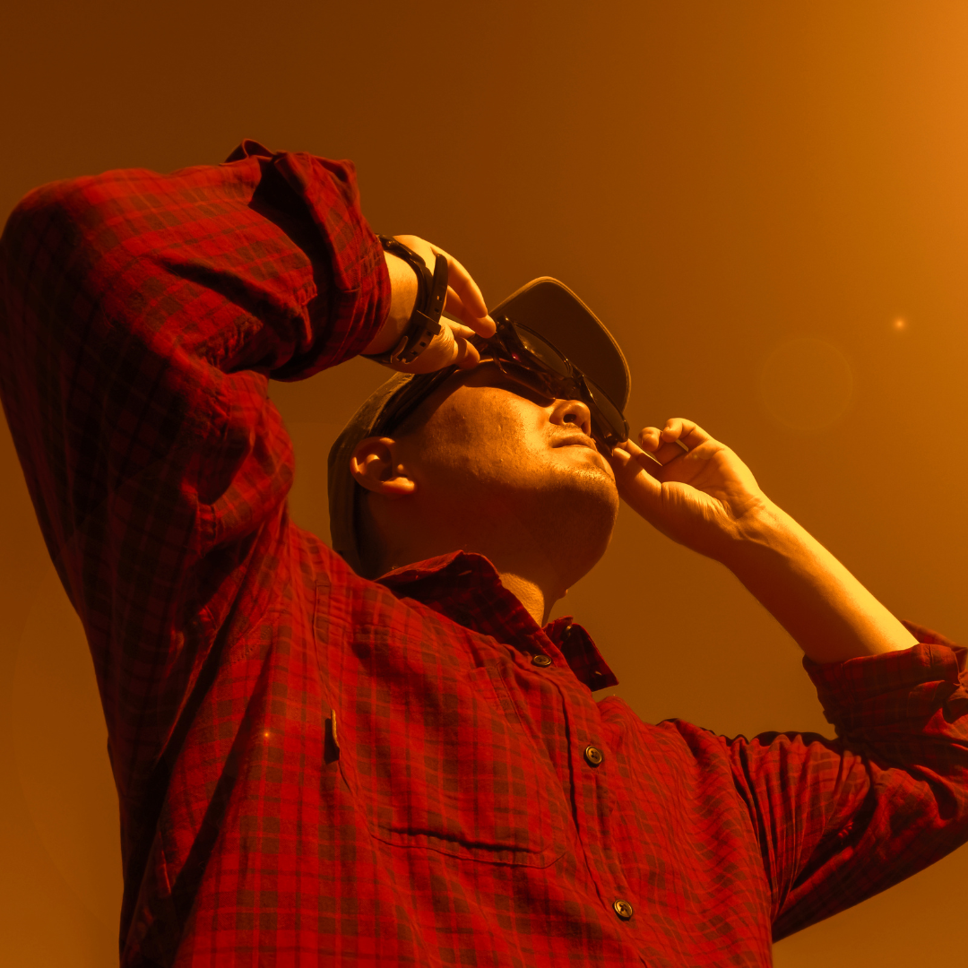 man observes an eclipse event with special viewing glasses
